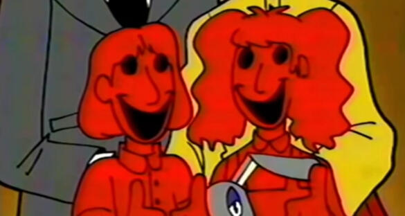 Molly Walten and Edd Walten standing next to each other giving thumbs up, Molly is holding Rocket and their parents are behind them